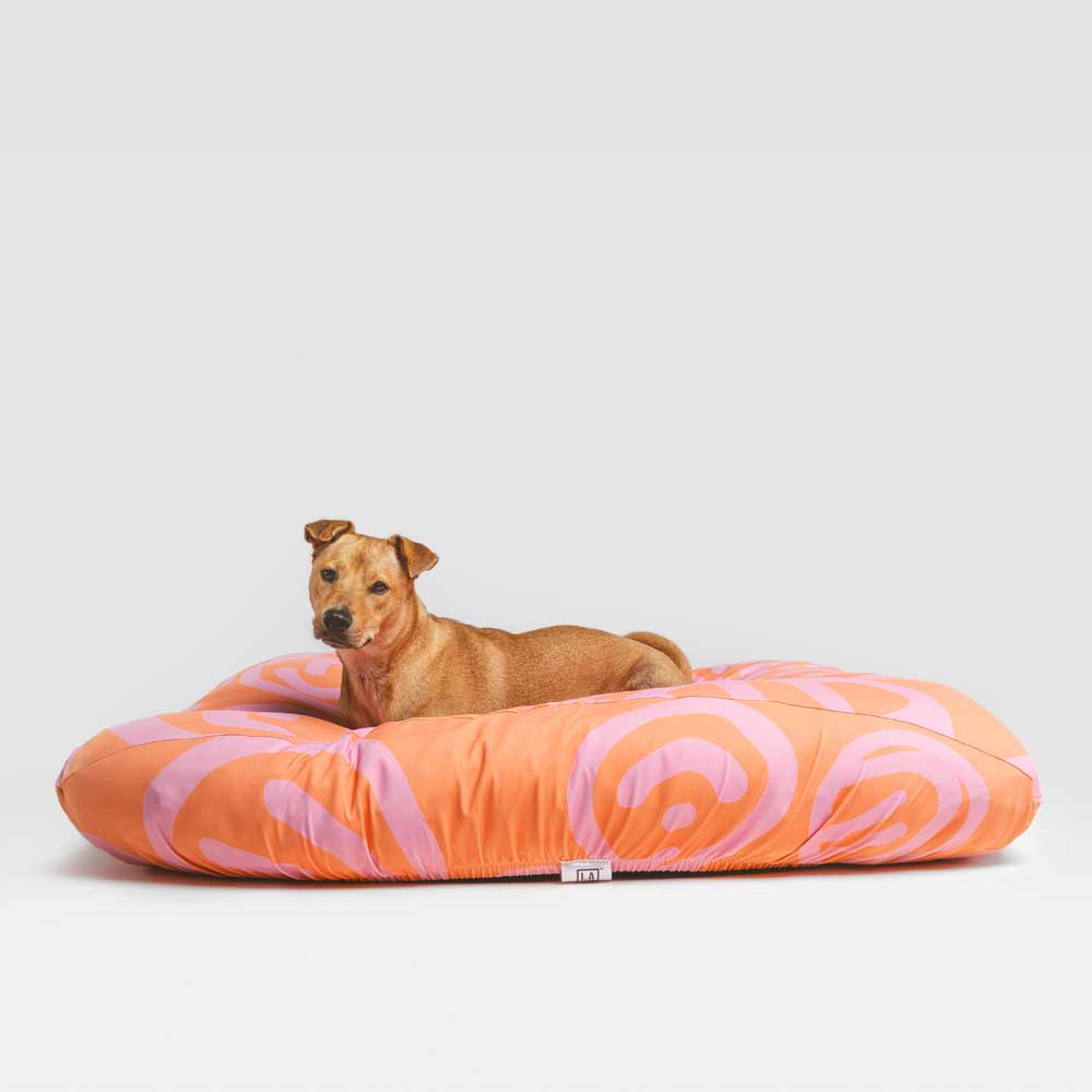 Cute dog on machine washable, fitted, cute pink and peach dog bed cover.