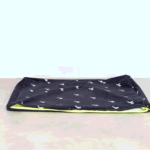 Black eco-friendly dog bed. Water resistant with washable, sustainable materials for easy cleaning and long-lasting comfort.