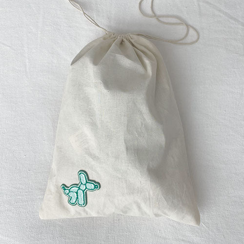 Dog laundry bag. Doubles as a travel bag. Pack treats, toys and your dog bed sheets. Adventure awaits with this personalized doggy bag. Upgrade your dog's bag with our iron on patches.