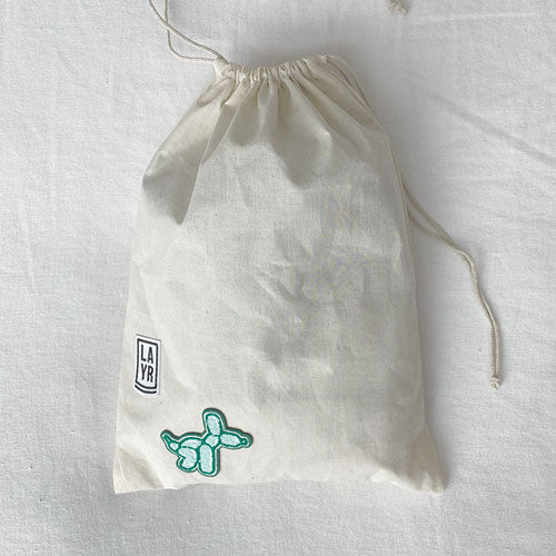 Dog laundry bag. Doubles as a travel bag. Pack treats, toys and your dog bed sheets. Adventure awaits with this personalized doggy bag. Upgrade your dog's bag with our iron on patches.