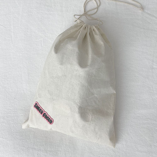 Dog laundry bag. Doubles as a travel bag. Pack treats, toys and your dog bed sheets. Adventure awaits with this personalized doggy bag. Upgrade your dog's bag with our iron on patches.