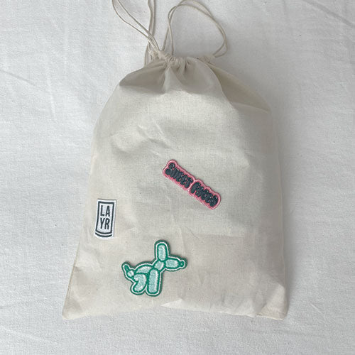 Dog laundry bag. Doubles as a travel bag. Pack treats, toys and your dog bed sheets. Adventure awaits with this personalized doggy bag. Upgrade your dog's bag with our iron on patches.