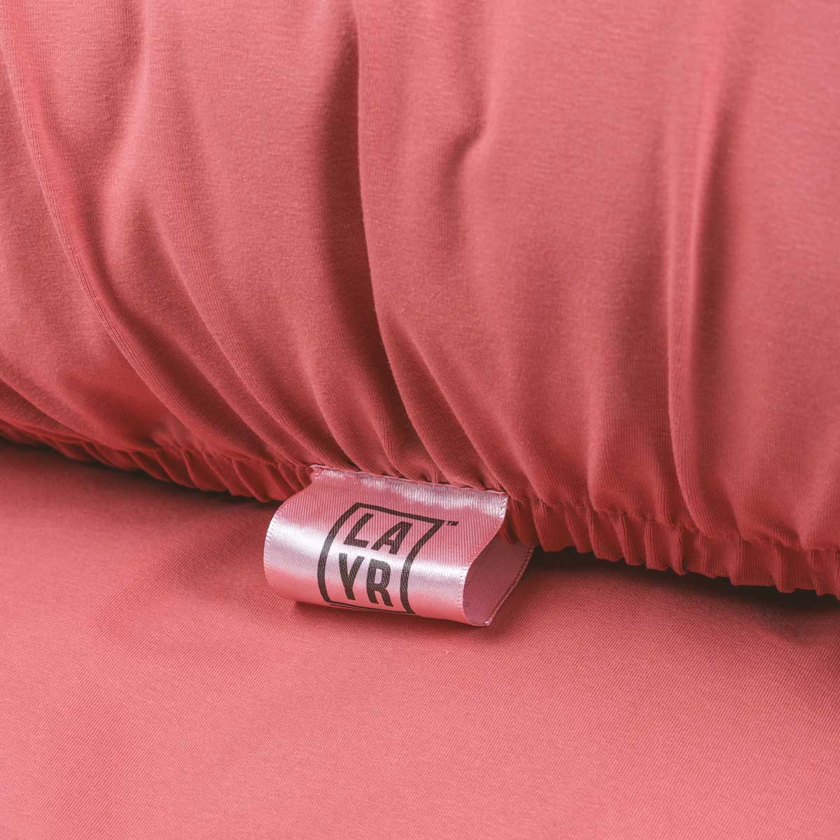 Rose colored anti microbial and  anti odor, machine washable, stretchy dog bed cover.